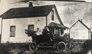 The first family car with Katie, Henry, Jennie, and Henry Jr.